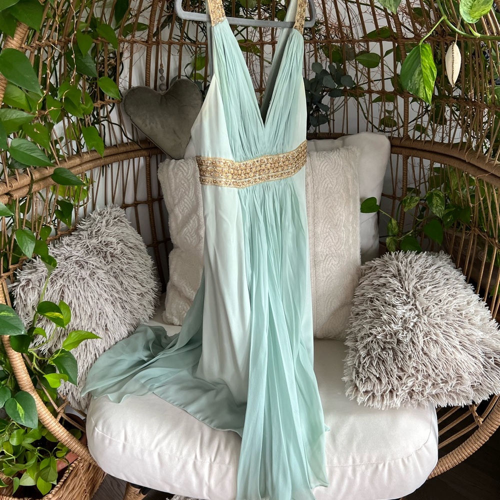 Elegant Light Blue Gown with Gold Accents